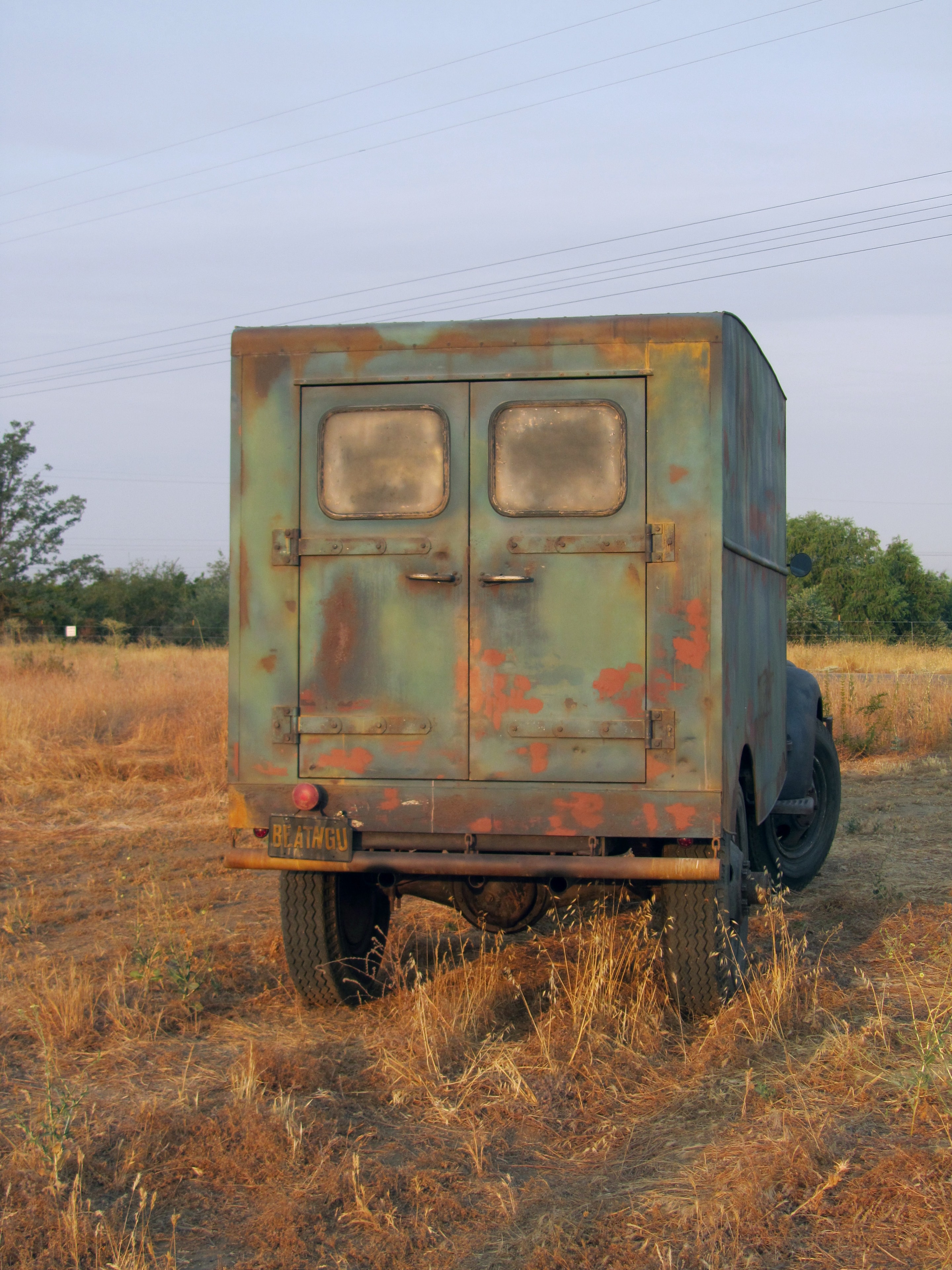 Old truck parked on dirt road countryside