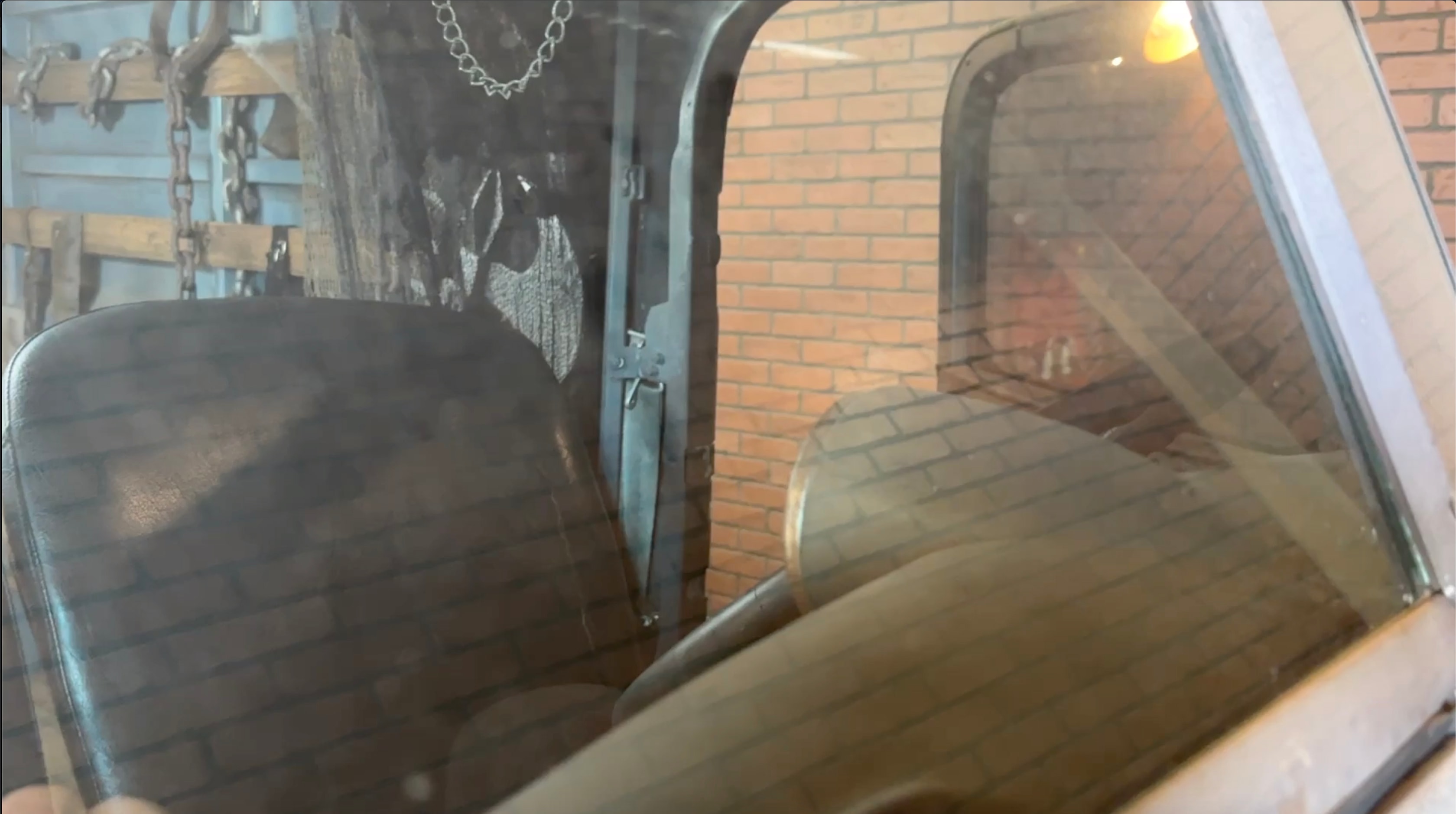 Old truck cab interior cracked windshield view